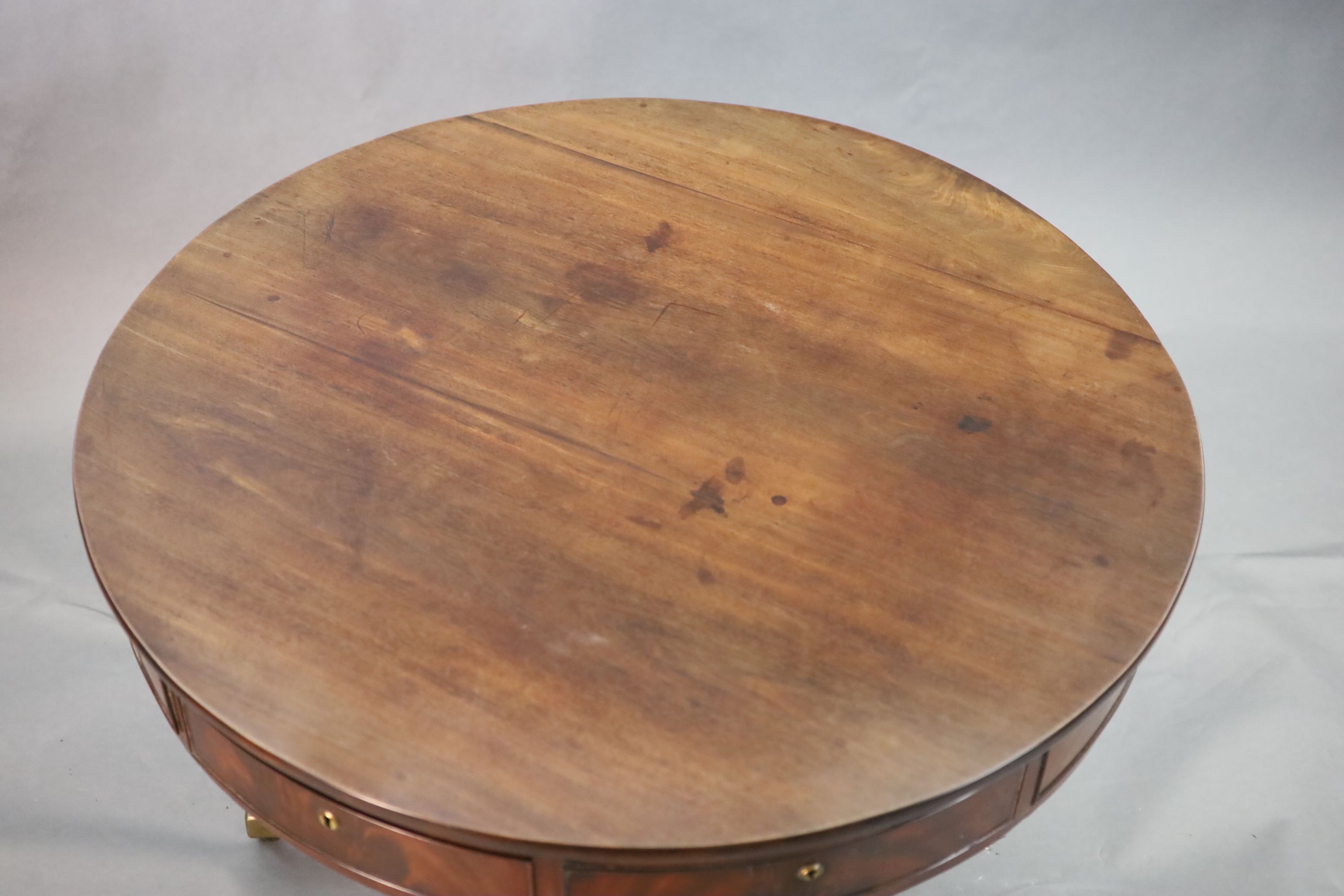 A Regency mahogany drum top library table,